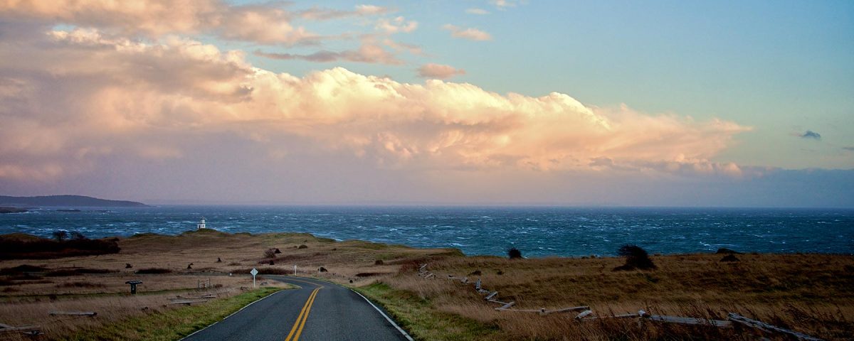 Cattle Point Road with view of rough seas in the distance